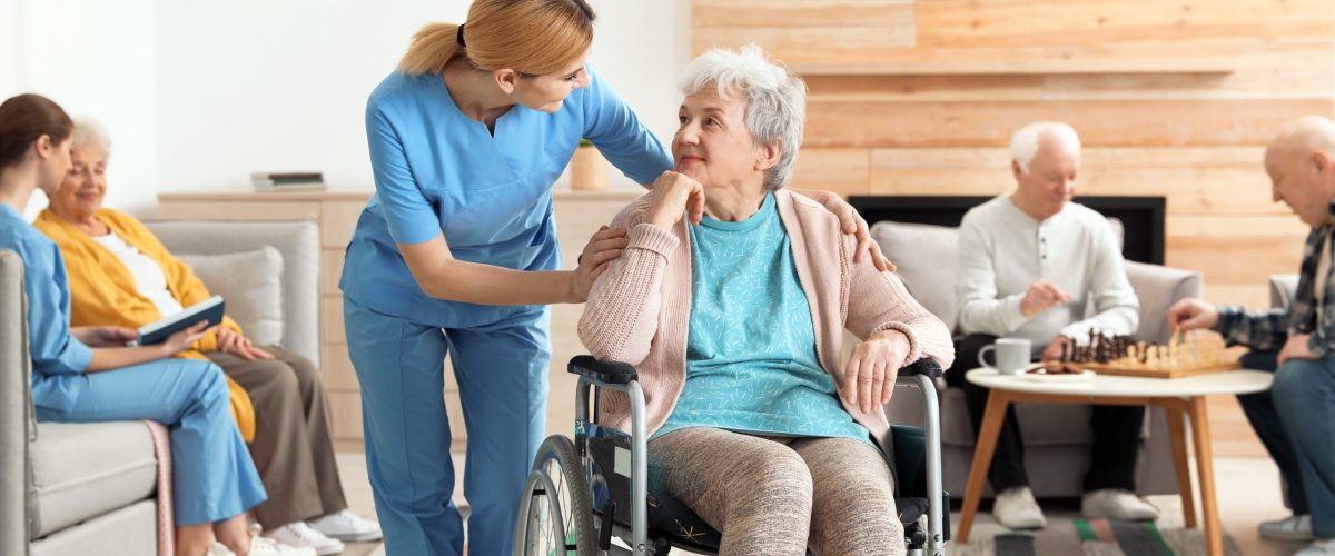 Nurses assisting elderly people at retirement home